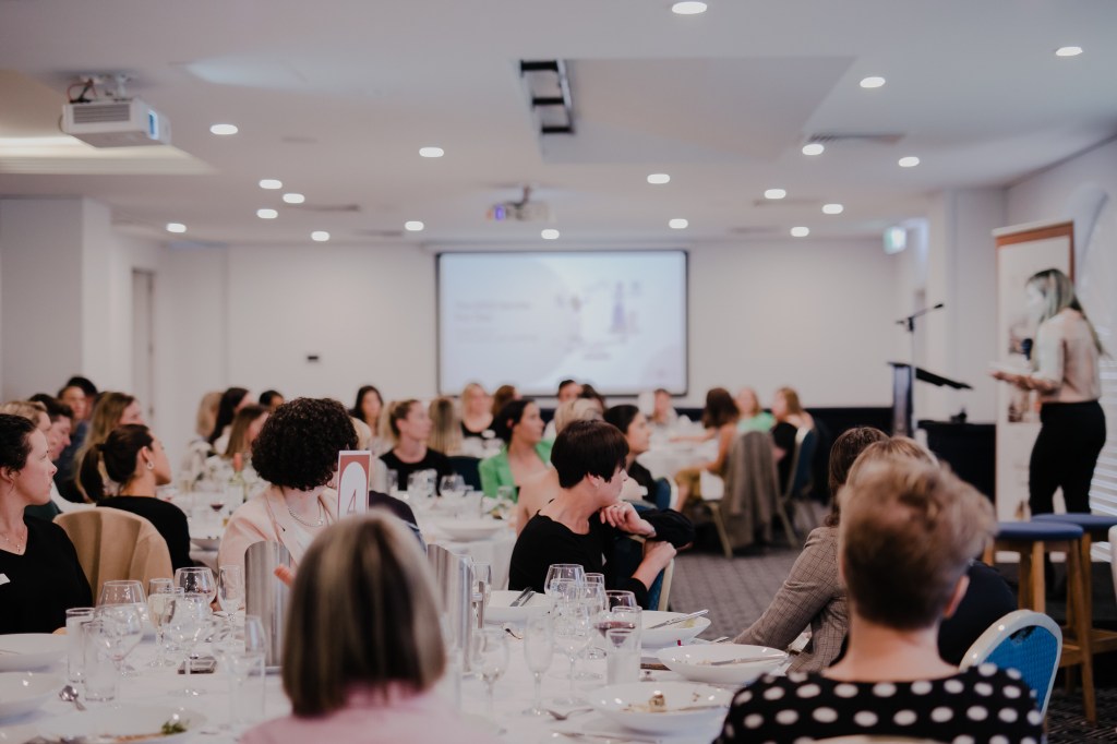 Photo of Steph speaking at WIDAC event